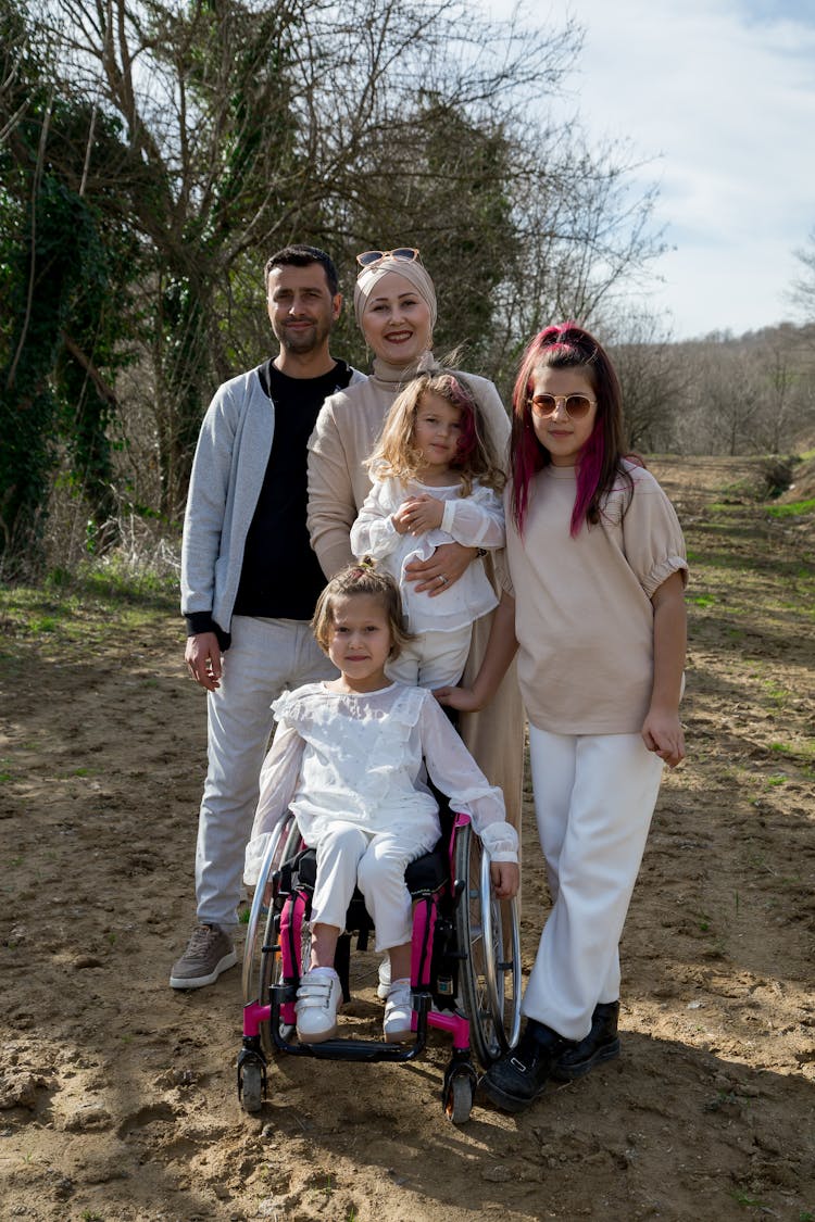 Cheerful Family With Girl In Wheelchair