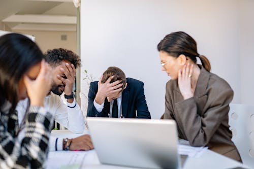 Free Stressed Businesspeople at an Office Stock Photo