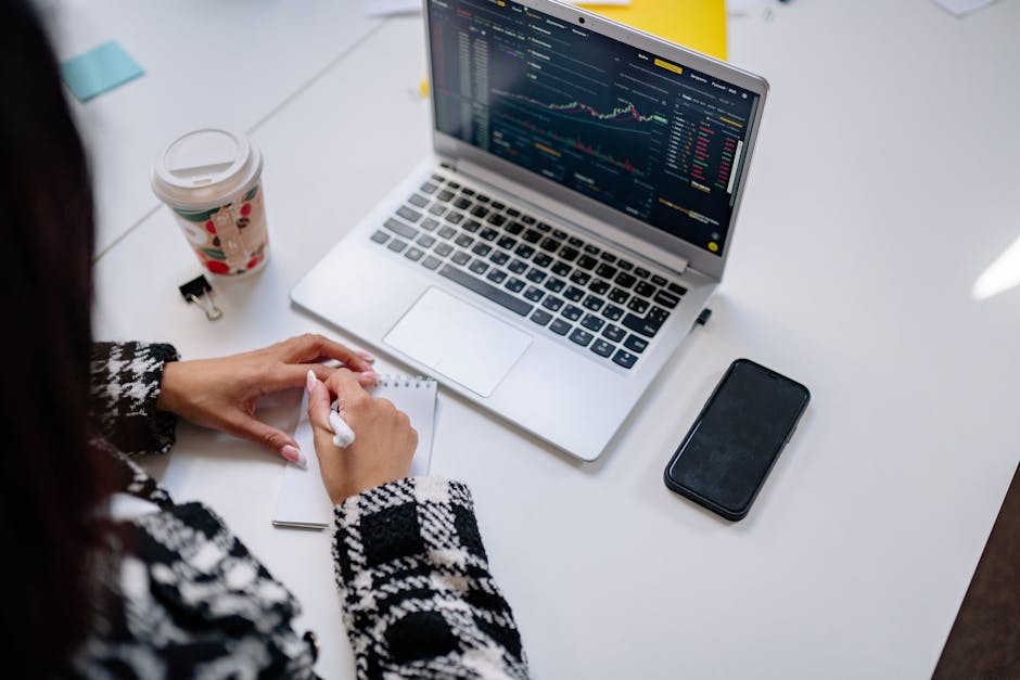 Person creating a financial plan with charts and notes - 5starsstocks.com income stocks Person creating a financial plan with charts and notes - 5starsstocks.com income stocks