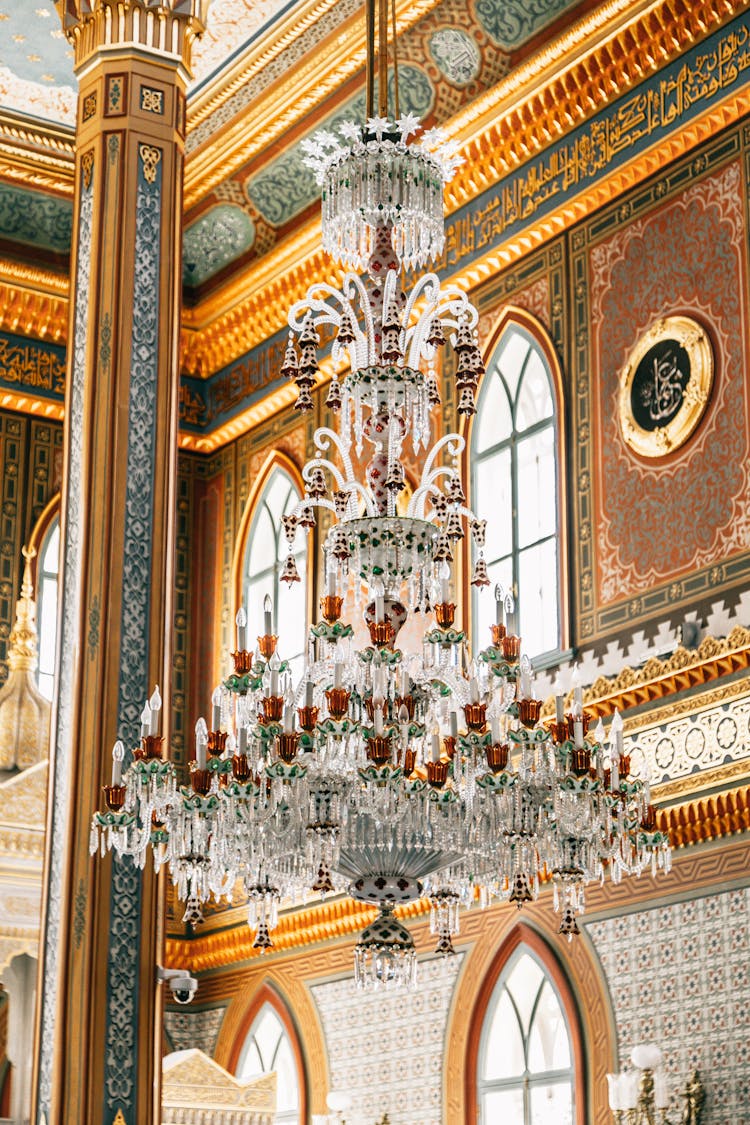 An Elegant Chandelier Hanging On The Ceiling