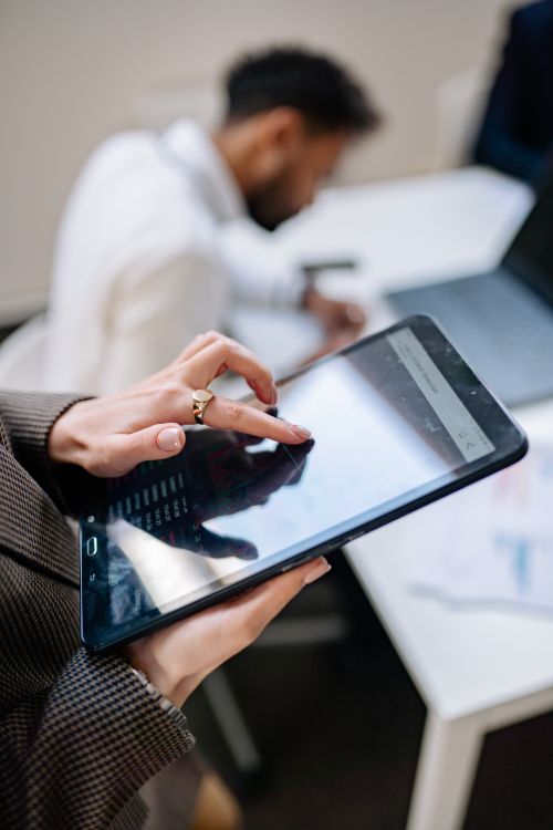 Research Interviewer Using Tablet Person Holding Black Tablet ยท Free Stock Photo