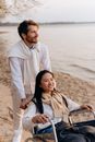 Man in White Dress Shirt Beside Woman in Black and White Stripe Dress Shirt