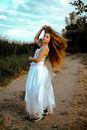 Woman Wearing White Dress Turning Around
