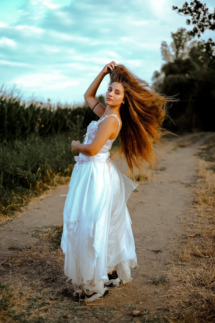 Woman Wearing White Dress Turning Around 