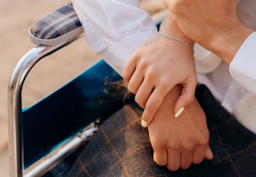 Close-Up Shot of a Couple Holding Hands