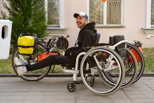 A Man Riding a Electric Wheelchair