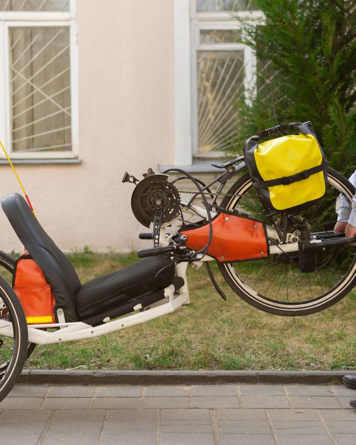 Adult man with Down syndrome using an adaptive handcycle outdoors