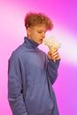 Curly Haired Man Smelling the White Flowers in the Ice Cream Cone