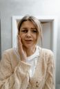 Crying Woman Touching the Bruise on Her Face