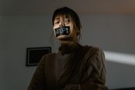 A Low Angle Shot of a Woman in Knitted Sweater Seeking for Help