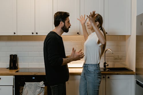 Free Couple Fighting at the Kitchen  Stock Photo