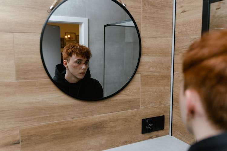 Reflection Of A Boy In The Round Mirror 