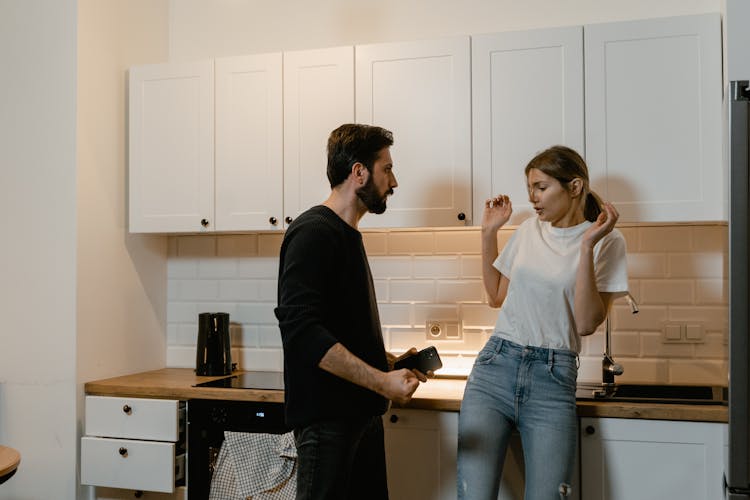 A Man Showing Aggression To A Woman