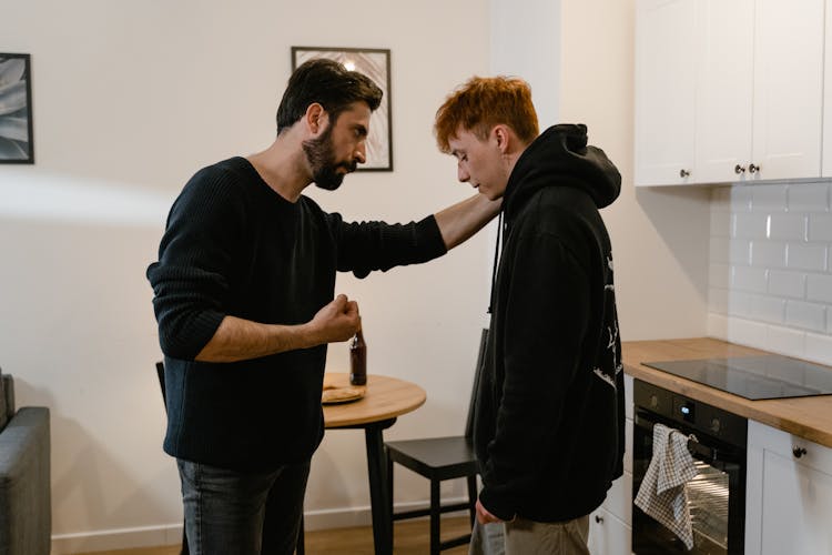 A Man Showing Aggression To His Son