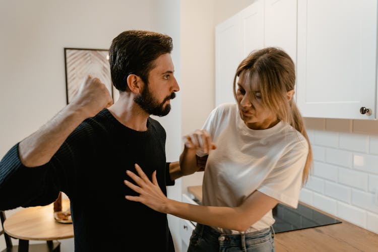 A Man Showing Aggression To A Woman
