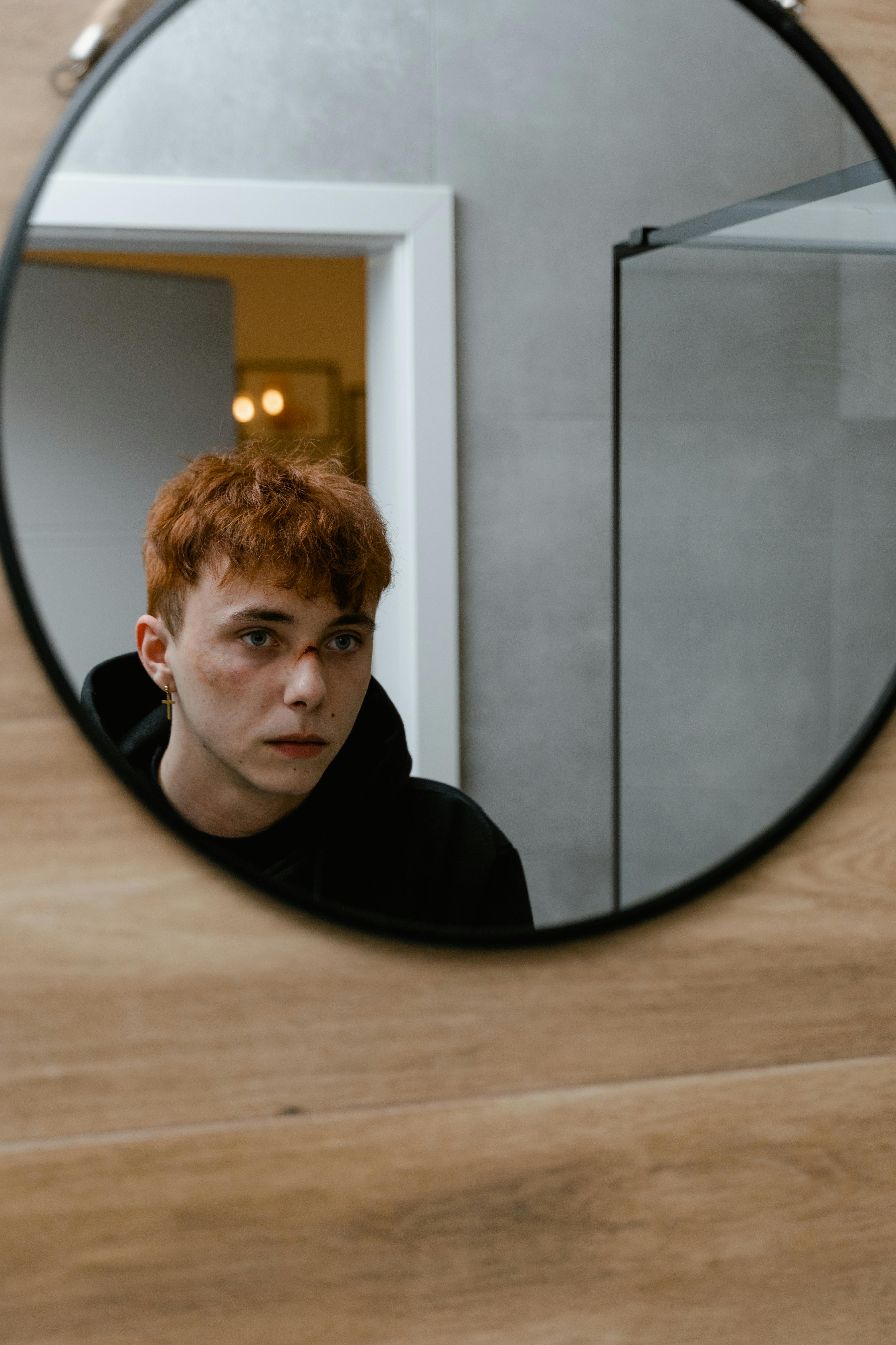 reflection of a boy in the round mirror