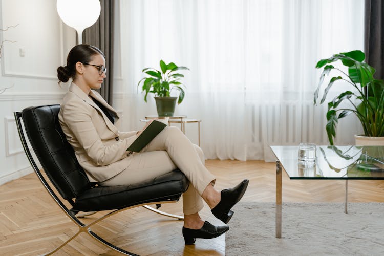 A Woman Sitting On A Chair