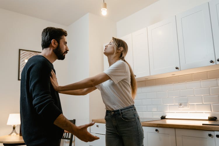 A Man And Woman Arguing Each Other 