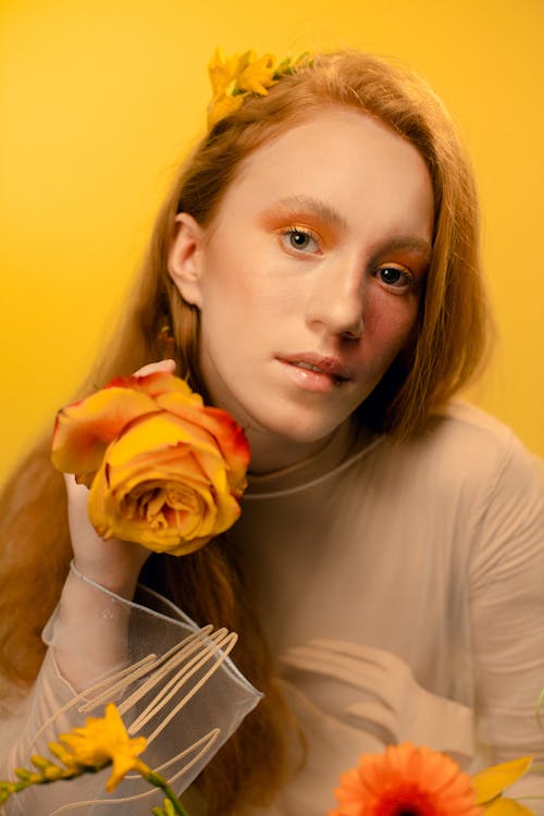 Free Portrait of a Girl Holding a Yellow Rose Stock Photo