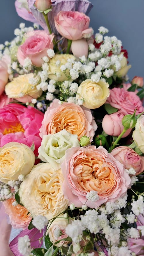 Free From above of bouquet of fresh flowers with white and yellow and pink petals Stock Photo