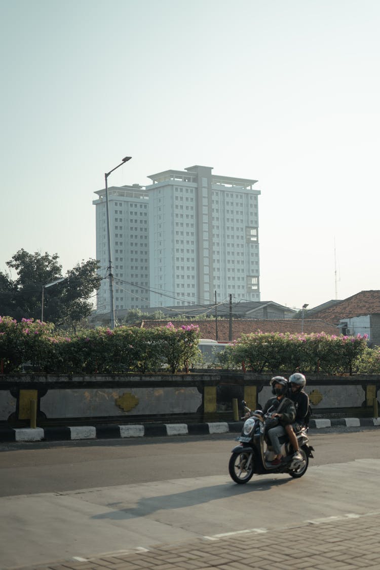 Man And Woman Riding Motorcycle