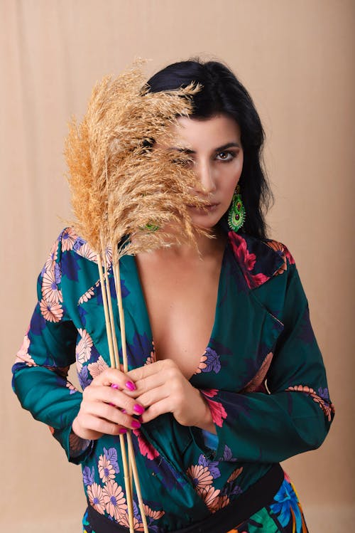A Woman Holding a Dried Pampas Grass