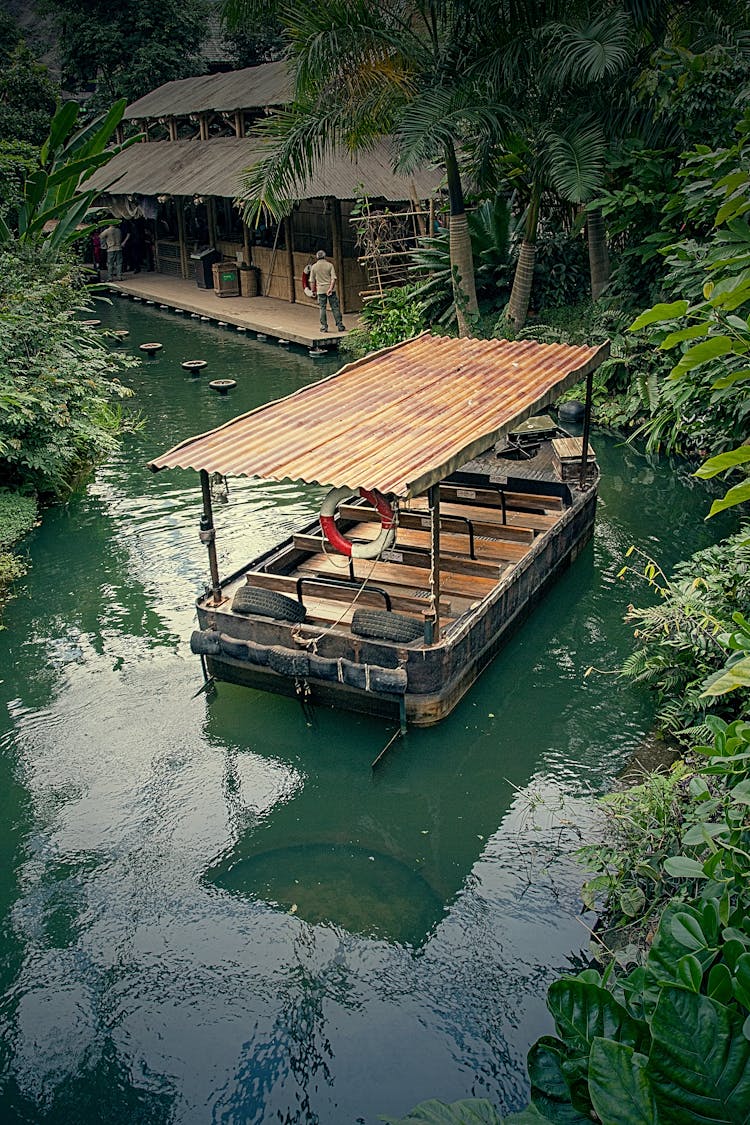 Passenger Boat On River In Jungle