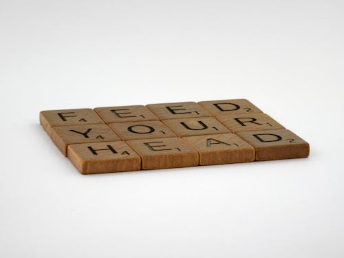 Wooden Letter Blocks on White Surface