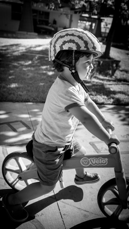 Free stock photo of balance bike, boy, helmet