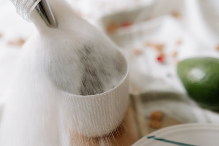 Sugar Spilled Over A White Ceramic Mug