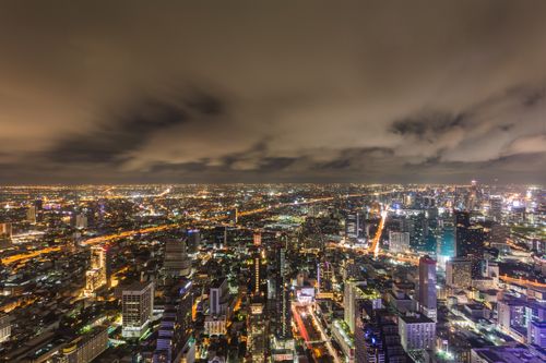 Free Breathtaking city lights of Bangkok from above, showcasing vibrant nightlife and illuminated skyline. Stock Photo