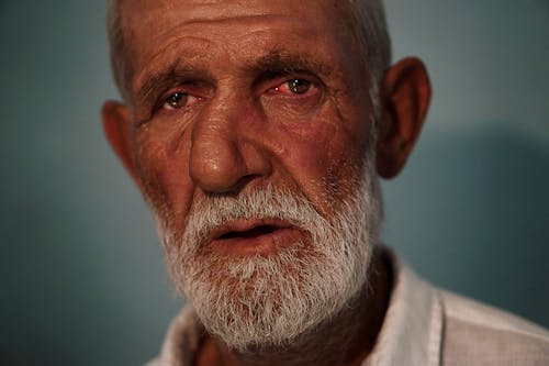 A Close-Up Shot of an Elderly Man
