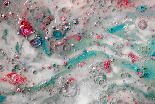 Close-Up Photograph of Bubbles on Colorful Liquid