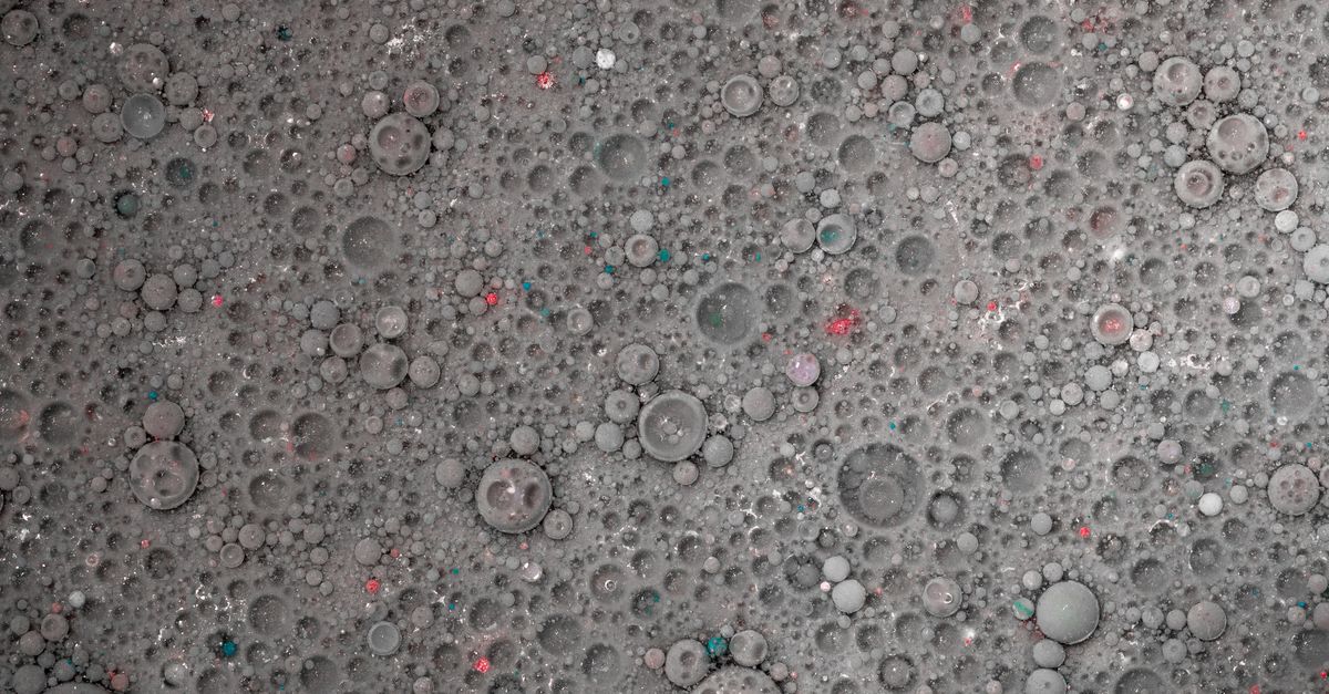 Macro shot of grey bubbles creating an abstract textured pattern, ideal for backgrounds.