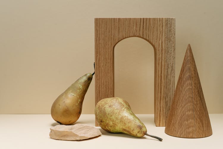 Pears And Wooden Objects N Flat Surface