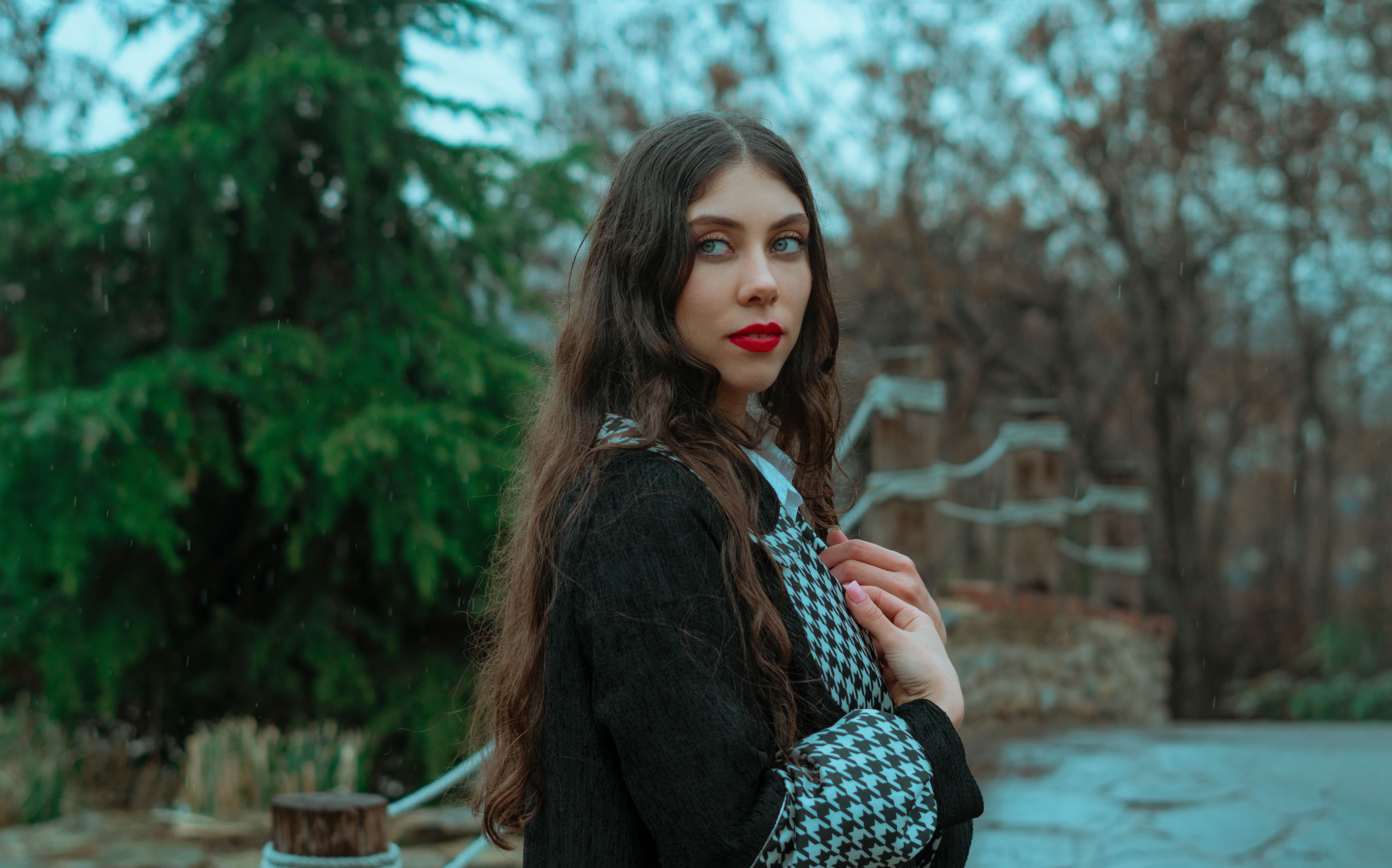 Charming woman with long hair standing in park · Free Stock Photo