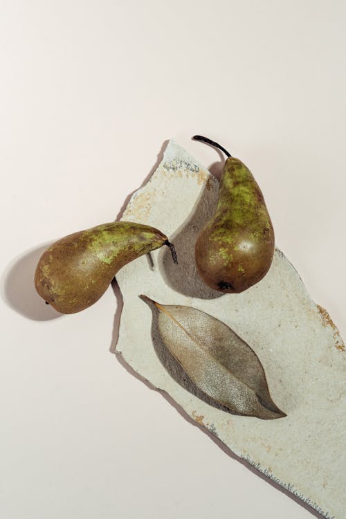 Top View of Pears and a Dried Leaf