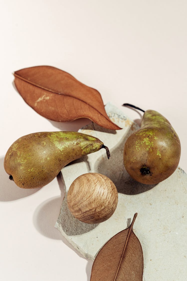 Pear Fruits And Dried Leaves Photo