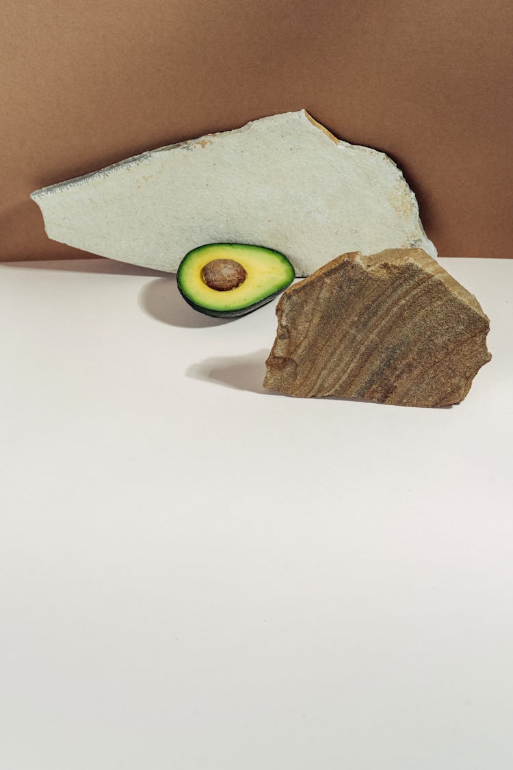 Sliced Avocado On White Surface