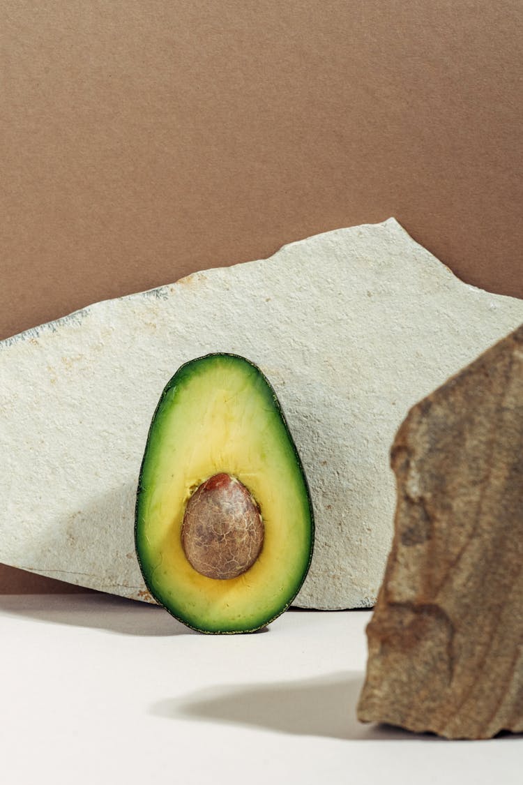 Sliced Avocado On White Surface