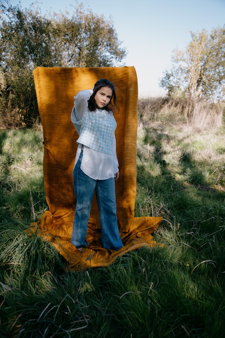 Woman In Blue And White Hounds Tooth Check Sweater Standing On Blanket