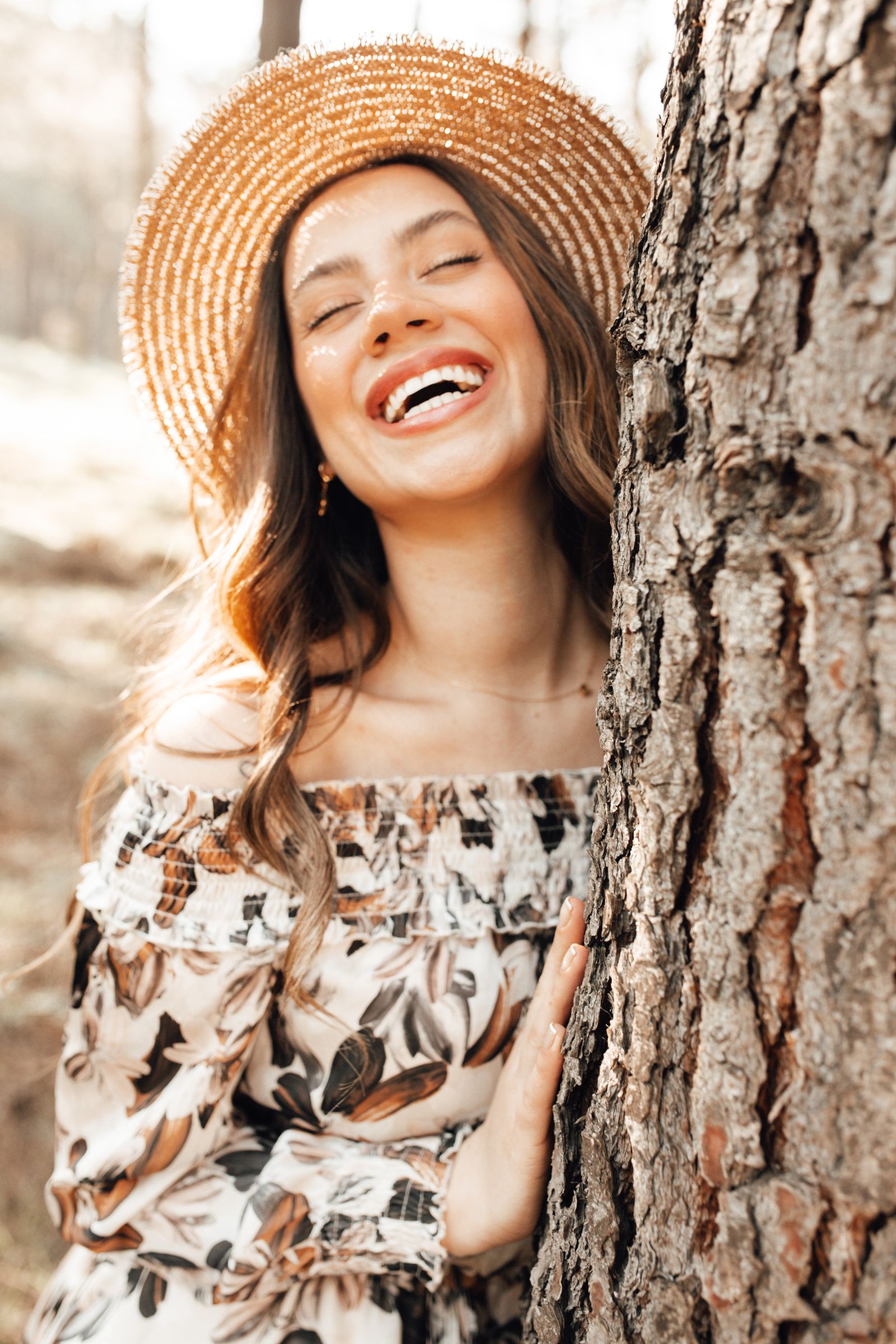 Amara Reyes laughing softly in golden light, a warm and grounded presence