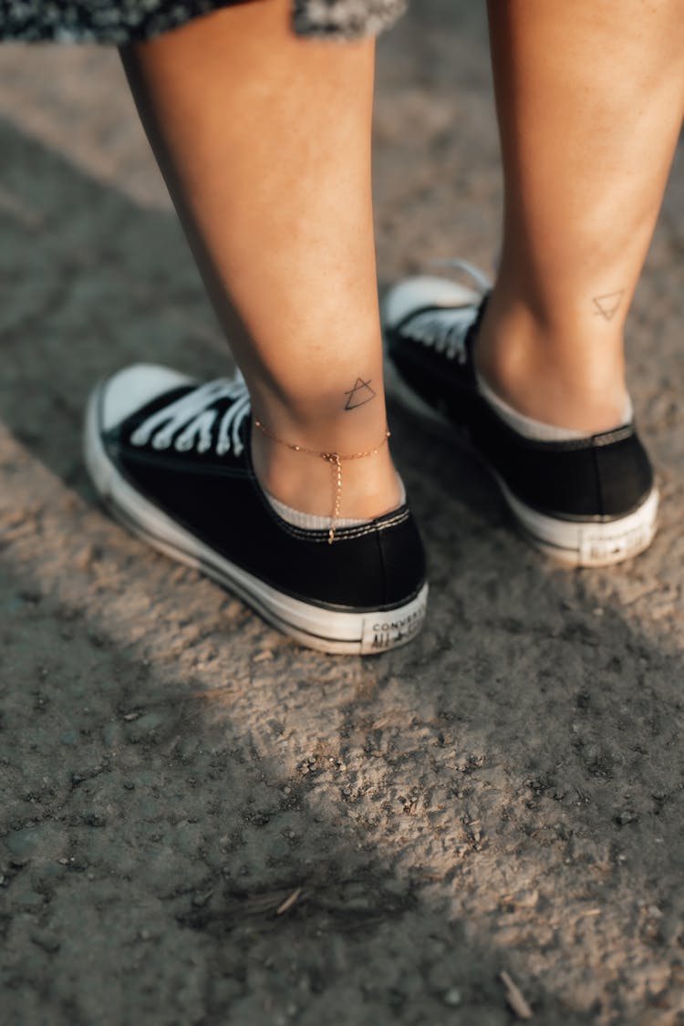 Close Up Of Tattoos On Legs