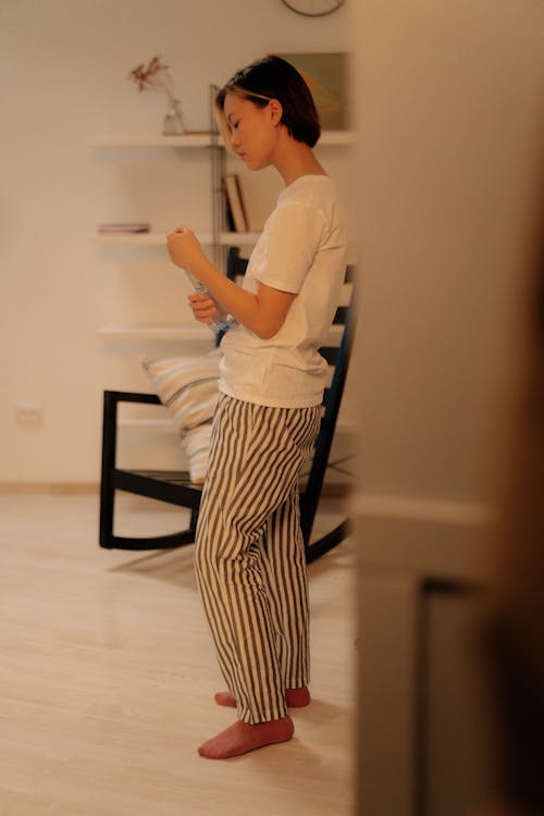 Free Side View of a Woman Wearing Her Pajamas Stock Photo