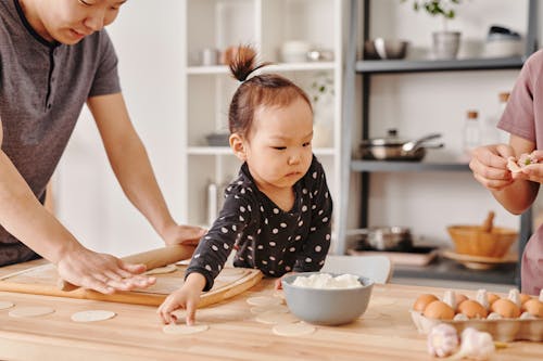 Free A Family Preparing Food Together Stock Photo