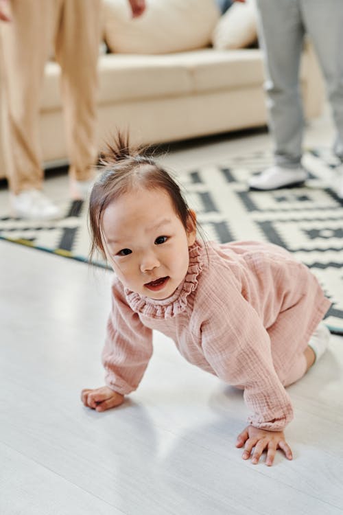 A Child Crawling on the Floor