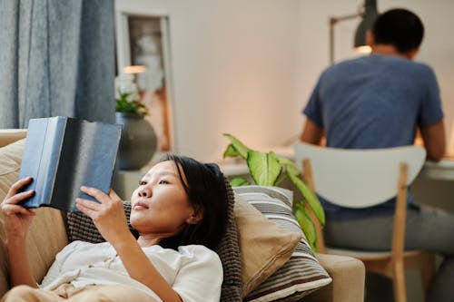 A Woman Reading on the Couch