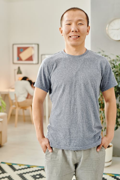 Free A Man Smiling with His Hands on His Pockets Stock Photo
