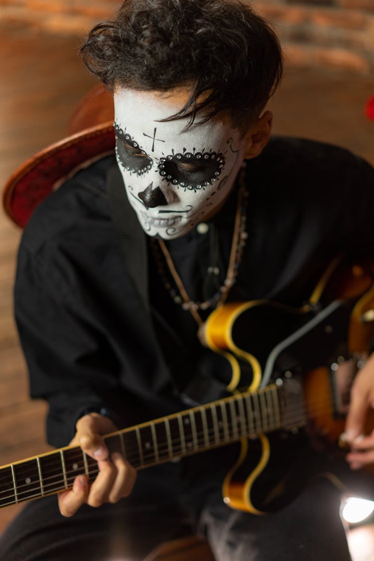 A Man Playing Guitar For The Day Of The Dead