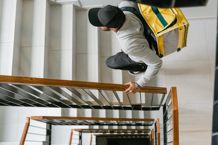 Deliveryman Going Up The Stairs